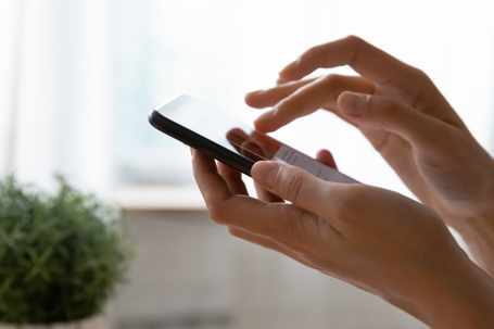 person texting on phone