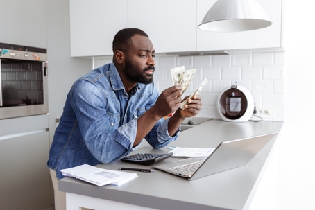 troubled man counting money