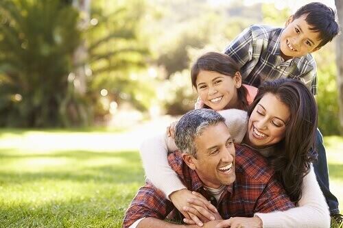 Family playing on the ground